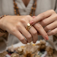 Gold coil nail ring featuring a smooth circular disc accent in polished gold for elegant everyday wear