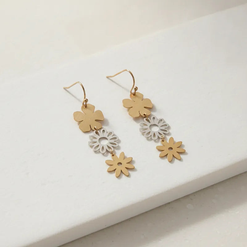 Gold and silver two-tiered floral dangle earrings with a sleek minimalist design for elegant wear