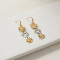 Gold and silver two-tiered floral dangle earrings with a sleek minimalist design for elegant wear