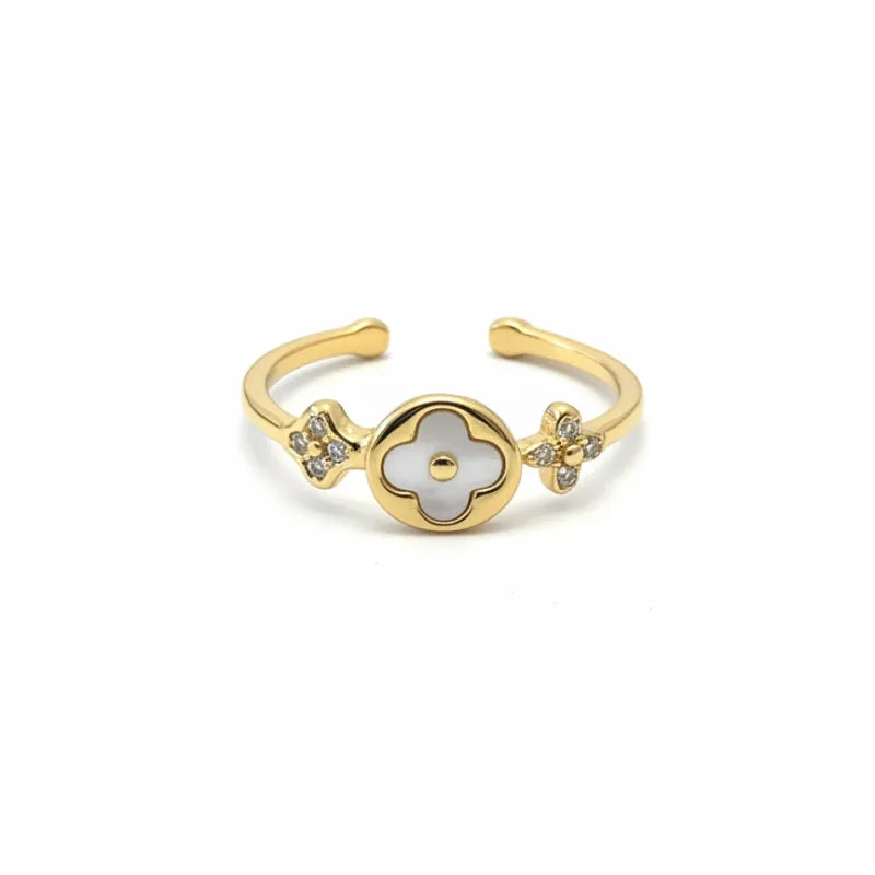 Gold-toned clover adjustable ring with a central white mother-of-pearl flower and diamond-studded floral accents