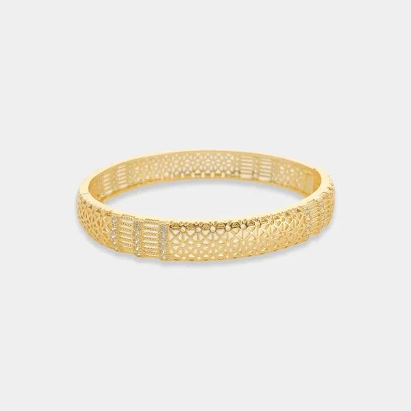 Gold-toned sun pattern bangle bracelet featuring intricate geometric and lattice pattern design in metal
