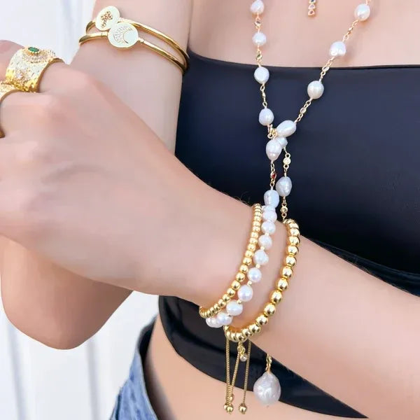 Gold-toned genuine pearl drawstring bracelet with alternating pearls and gold beads featuring a dangling pearl accent
