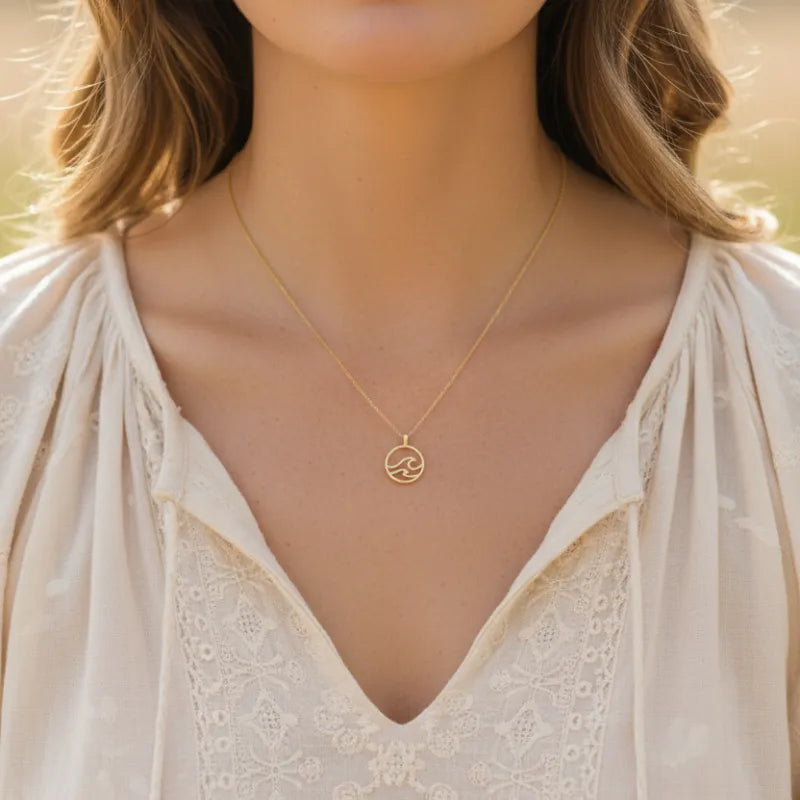 Gold dipped wave coin pendant necklace with minimalist design on delicate chain
