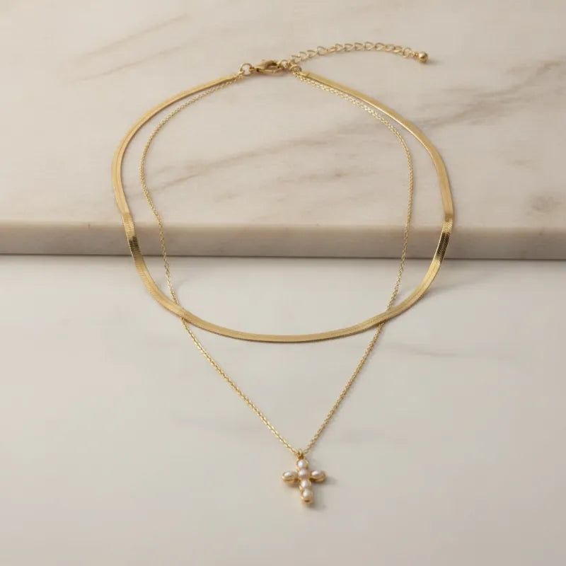 Gold-toned double snake chain choker necklace with delicate chain and pearl-adorned cross pendant charm