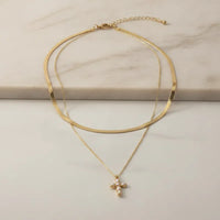 Gold-toned double snake chain choker necklace with delicate chain and pearl-adorned cross pendant charm