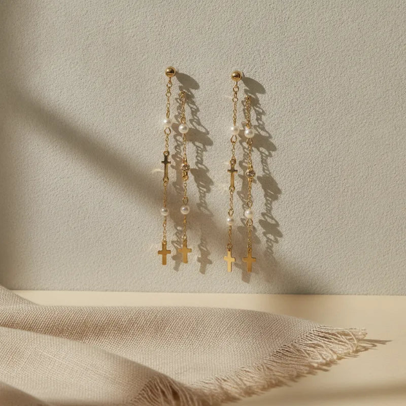 Chic gold filled layered cross pearl beaded drop earrings with gold toned chains featuring pearls and cross pendants