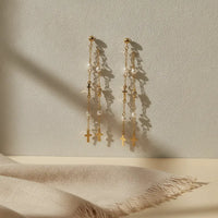 Chic gold filled layered cross pearl beaded drop earrings with gold toned chains featuring pearls and cross pendants