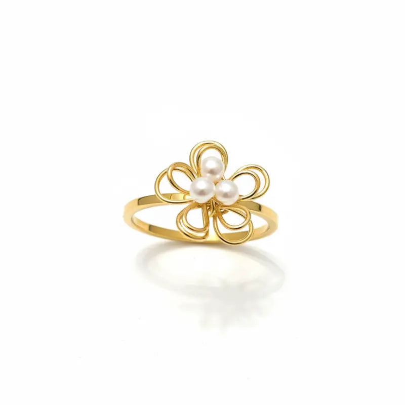 Gold-toned pearl blossom wire ring featuring three white pearls at the center in a delicate blossom wire design