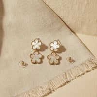 Elegant double flower mother of pearl gold drop earrings featuring gold-toned four-petal flower design with inlays