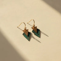 Gold-toned geometric drop earrings with rustic copper and deep teal layered triangles for a modern minimalist look