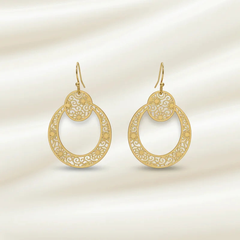 Boho filigree hoop earring in gold with intricate swirling patterns