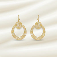Boho filigree hoop earring in gold with intricate swirling patterns