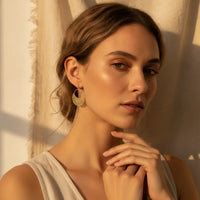 Gold-toned boho filigree metal drop earring with intricate filigree detailing and delicate openwork design