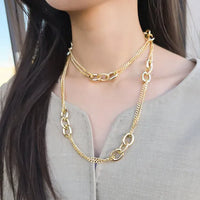 Gold-toned mixed link chain necklace featuring layered oval and link designs in a stylish link chain necklace