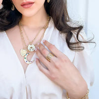 Triple layer mariner ring: gold-toned necklace with moon, shell, disc charms