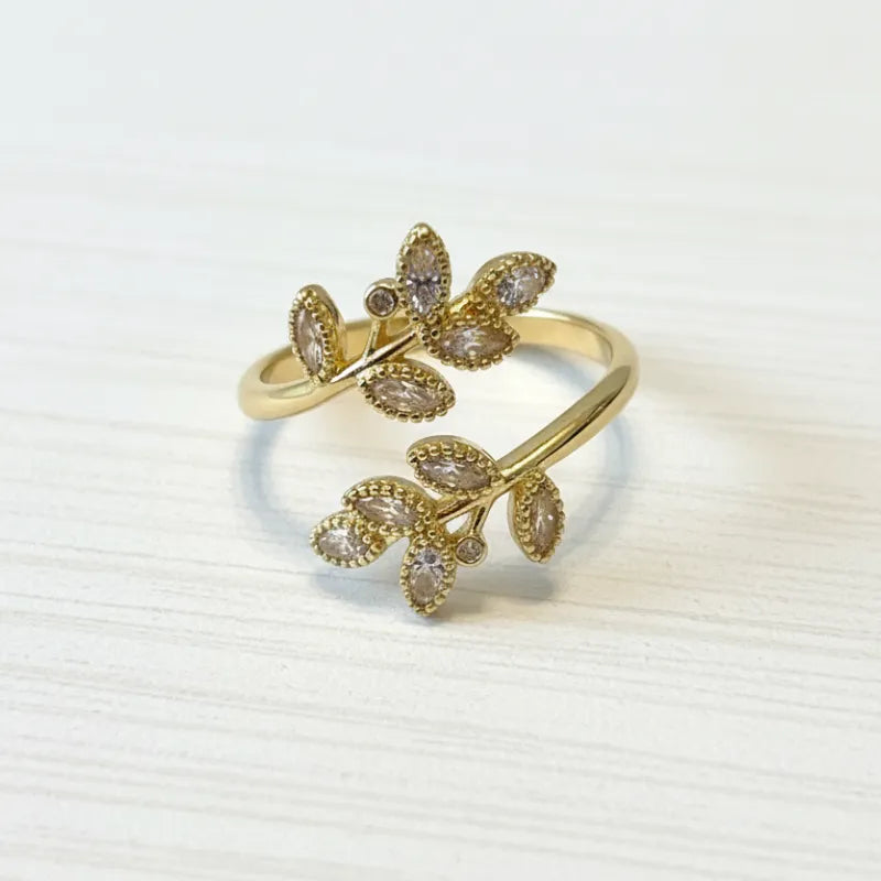 Ethereal leaf adjustable ring gold-toned with clear and light purple marquise-cut crystals in leaf design