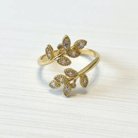 Ethereal leaf adjustable ring gold-toned with clear and light purple marquise-cut crystals in leaf design