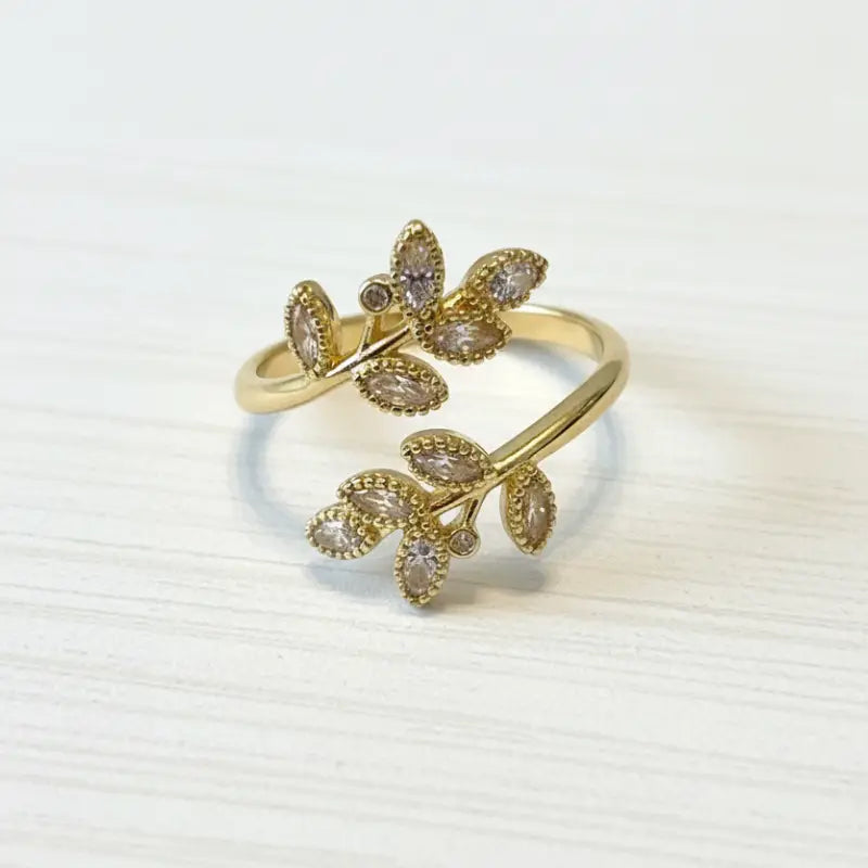 Ethereal leaf adjustable ring gold-toned with clear and light purple marquise-cut crystals in leaf design