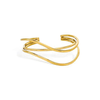 Gold-toned minimalist cuff bracelet with a sleek intertwined wire design featuring water resistant three curved bands