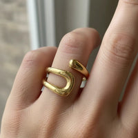 Bohemian gold organic open ring with gold-toned minimalist design featuring two interlocking curved bands