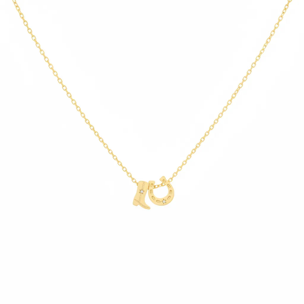 Gold dipped cowboy boots and horse shoe charm necklace with sparkling stones