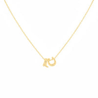 Gold dipped cowboy boots and horse shoe charm necklace with sparkling stones