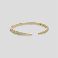 Gold-toned cubic zirconia open cuff bracelet with dense pavé of clear sparkling stones along curved surface