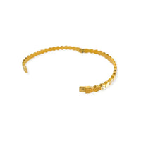 Gold-toned water resistant bangle with textured segmented design and small embedded stones for durable wear