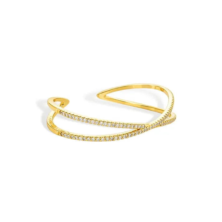 Gold-toned crisscross shape open cuff bracelet with two diamond-lined interlocking bands in an open cuff design