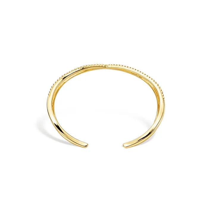 Gold-toned crisscross shape open cuff bracelet with a delicate beaded texture along its inner edge