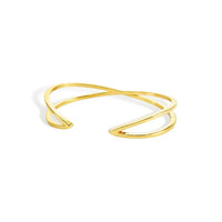 Gold-toned shape open cuff bracelet with sleek modern design featuring two intersecting bands crisscross shape open cuff