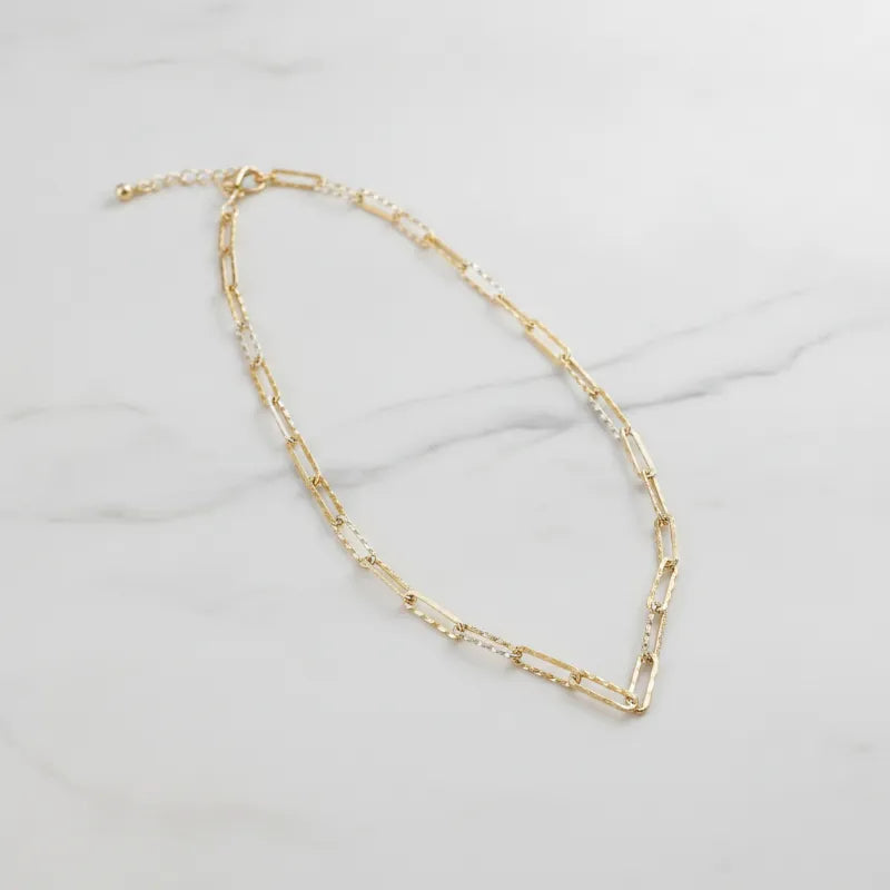 Textured gold link necklace featuring a gold-toned paperclip chain with alternating links and a small ball clasp