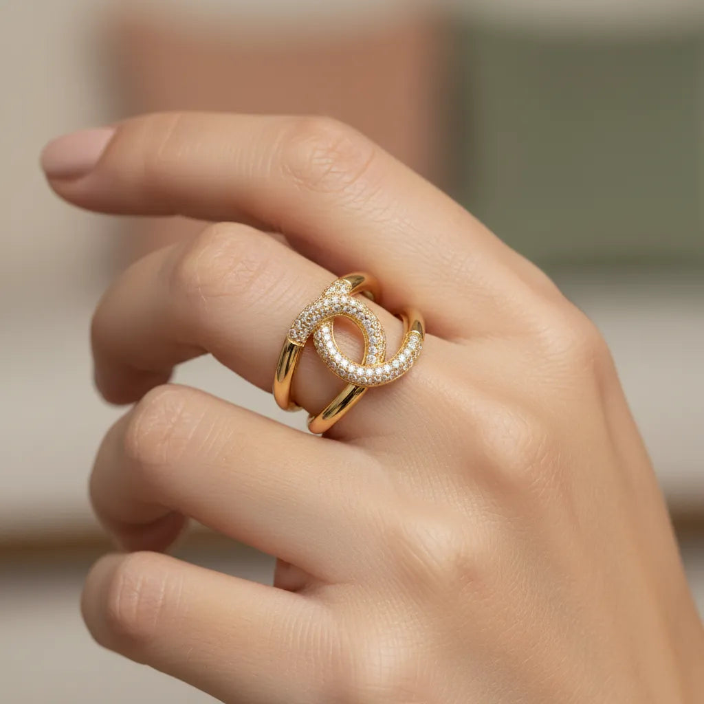 Gold-toned open ring accented with cubic zirconia, double interlocking circles