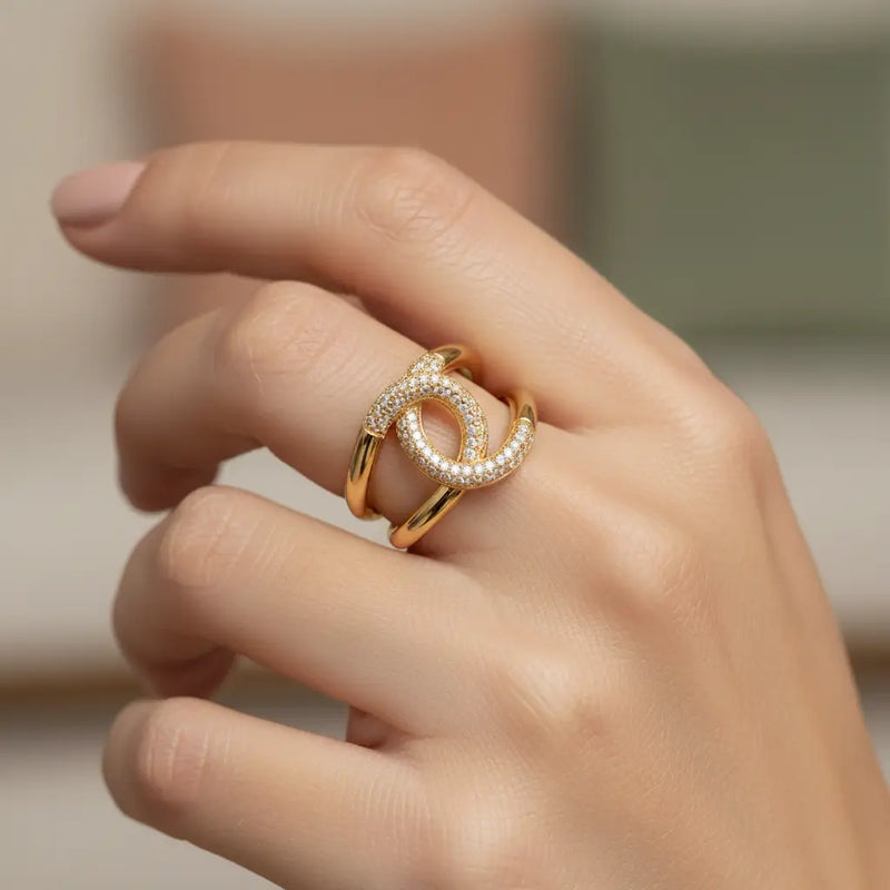 Gold-toned open ring accented with cubic zirconia, double interlocking circles
