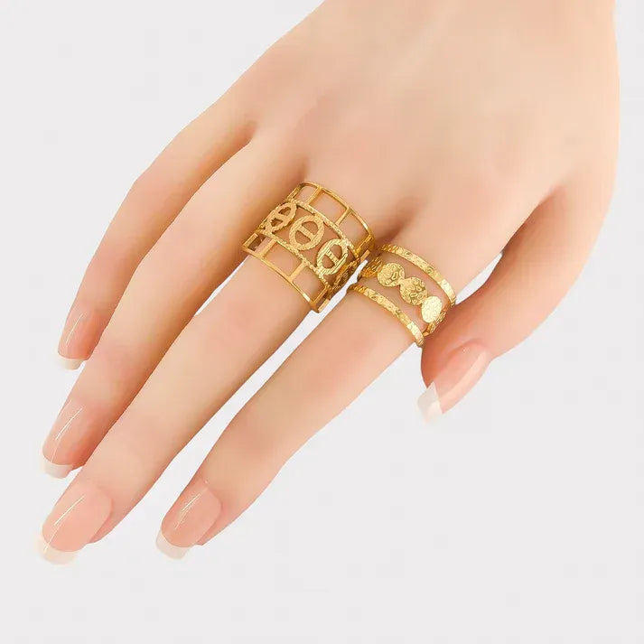 Gold-toned water resistant ring circle pattern with openwork circles