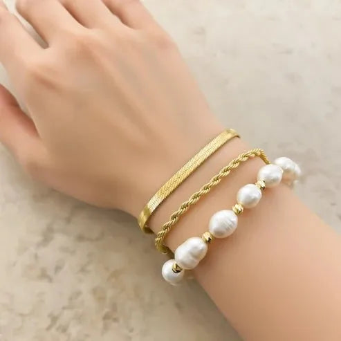Gold-toned snake chain bracelet paired with twisted gold rope and genuine pearl bracelet featuring freshwater pearls
