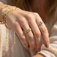 Gold dipped link statement ring with textured segmented design in a gold dipped link statement style