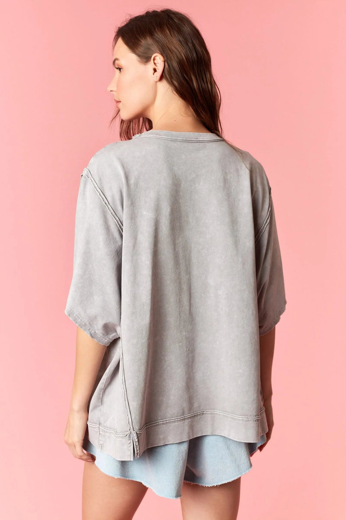 Gray oversized sweatshirt with relaxed fit and subtle distressed texture in american flag garment dye wash style