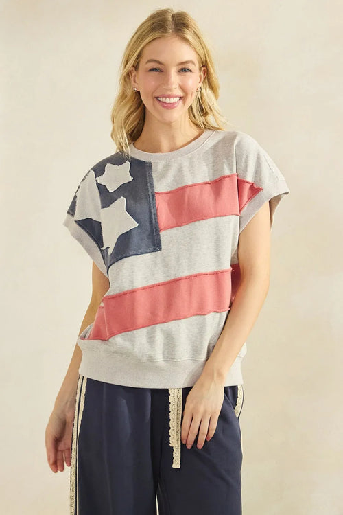 Gray mineral wash sweatshirt featuring an american flag patch design with navy stars and coral pink stripes
