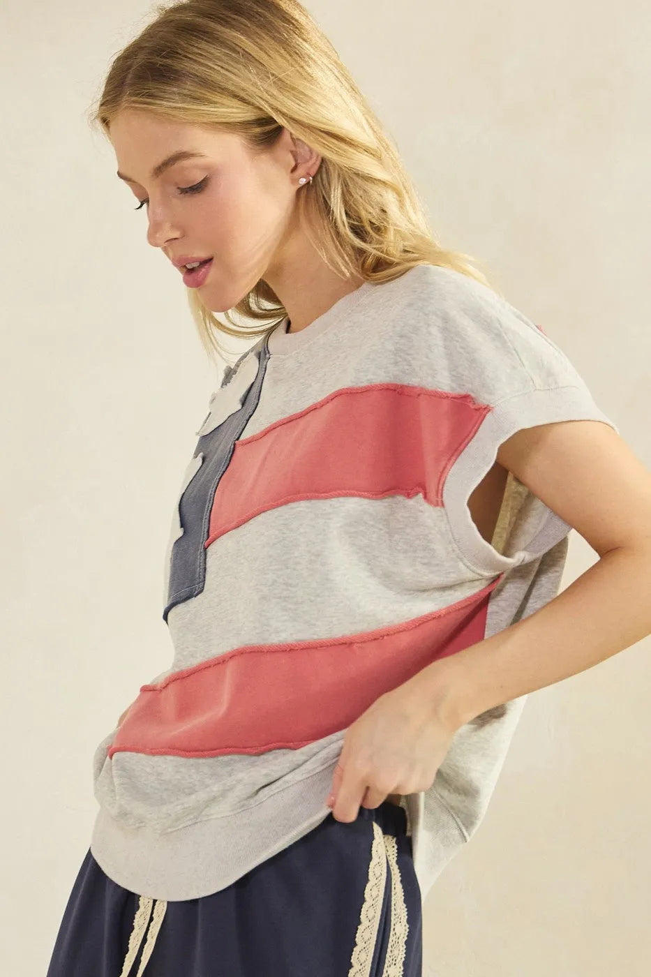 Gray mineral wash t-shirt with american flag patch featuring pink and navy blue patchwork stripes