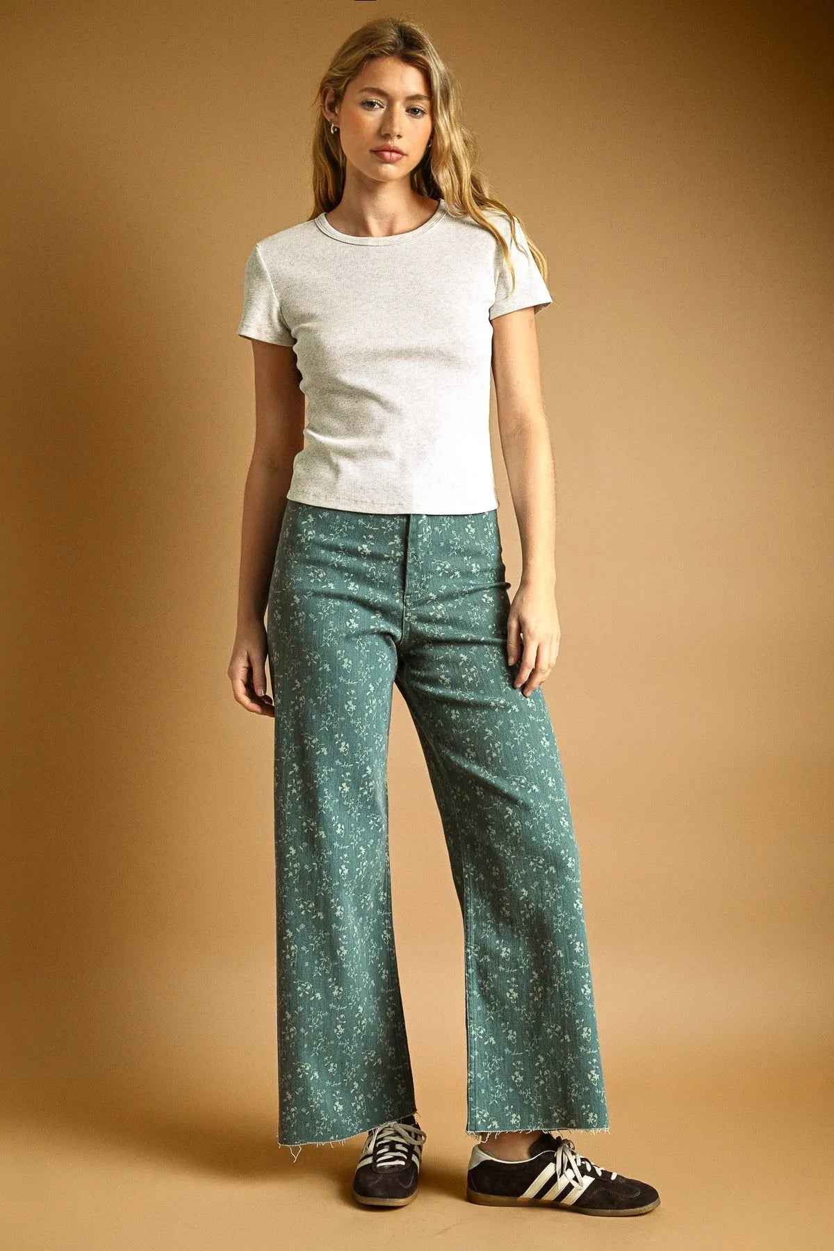 Green floral print stretched wide leg pants with frayed hem made from a comfortable fabric perfect for casual wear