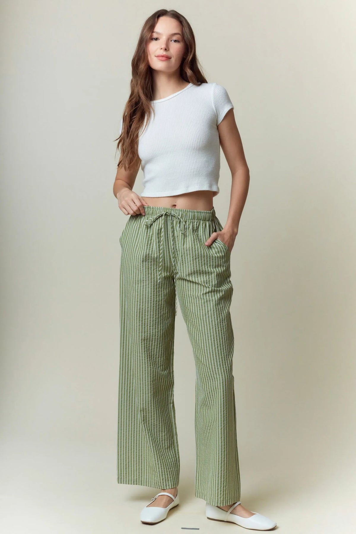Yarn dye stripe wide-leg pants in green and white with elastic drawstring waist for comfortable wear
