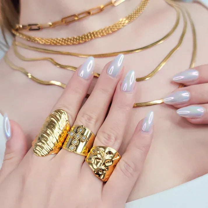 Water resistant wrinkle design gold ring on hand with unique textures