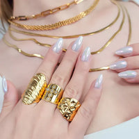 Water resistant wrinkle design gold ring on hand with unique textures