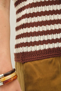 A hand-knitted textured stripe tank sweater with brown and cream horizontal stripes and a crochet pattern