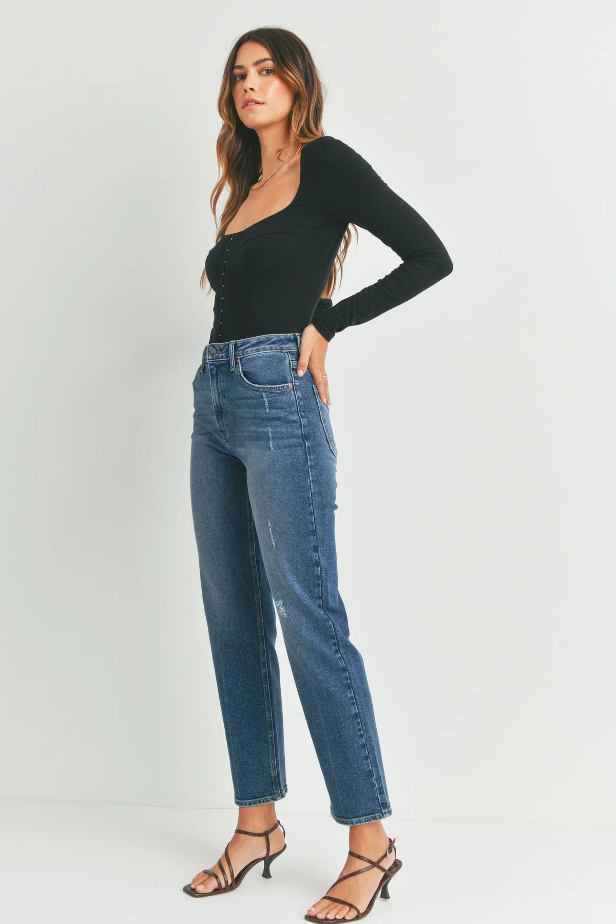 High-waisted full length straight denim jean in blue with subtle distressing and a length straight denim cut