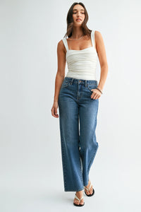 High-waisted blue denim jeans with stretch straight denim fabric and a loose low rise straight-leg cut