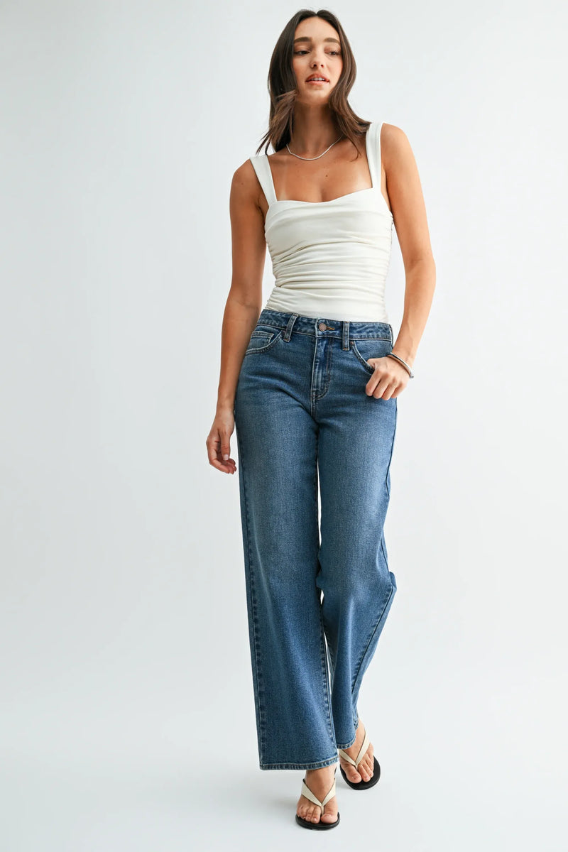 High-waisted blue denim jeans with stretch straight denim fabric and a loose low rise straight-leg cut