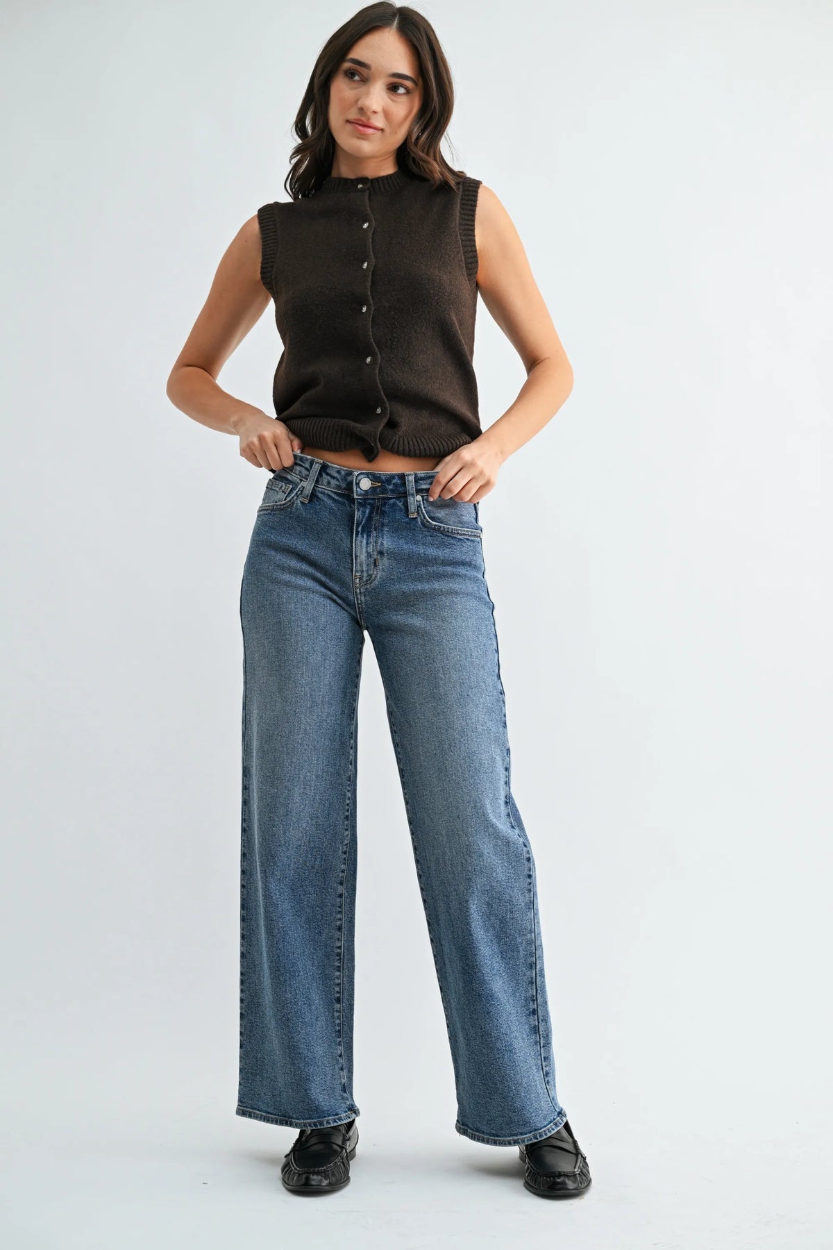 High-waisted blue denim jeans with a straight-leg cut and classic five-pocket design in mid wash wide style