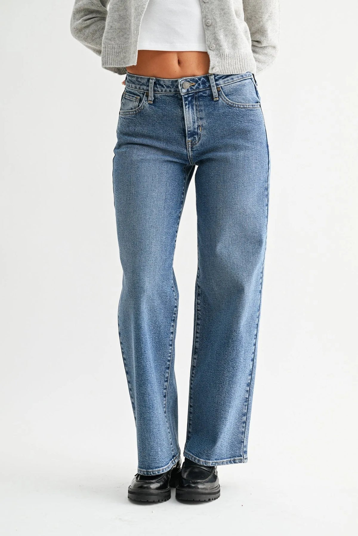 High-waisted blue denim mid rise jeans with slim wide leg cut and classic five-pocket design with light stretch
